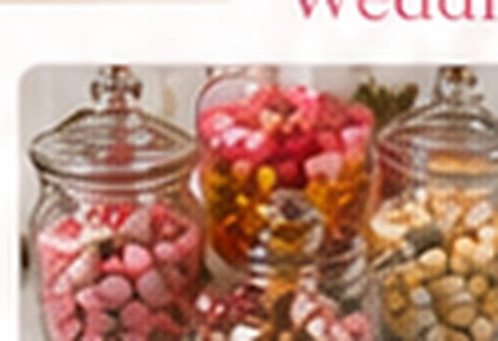 Glass jars of sweets for wedding guest tables